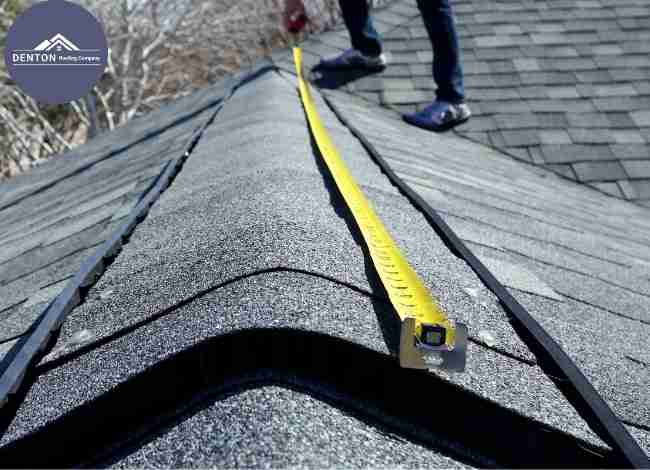 Roof inspector measuring shingle ridge with tape